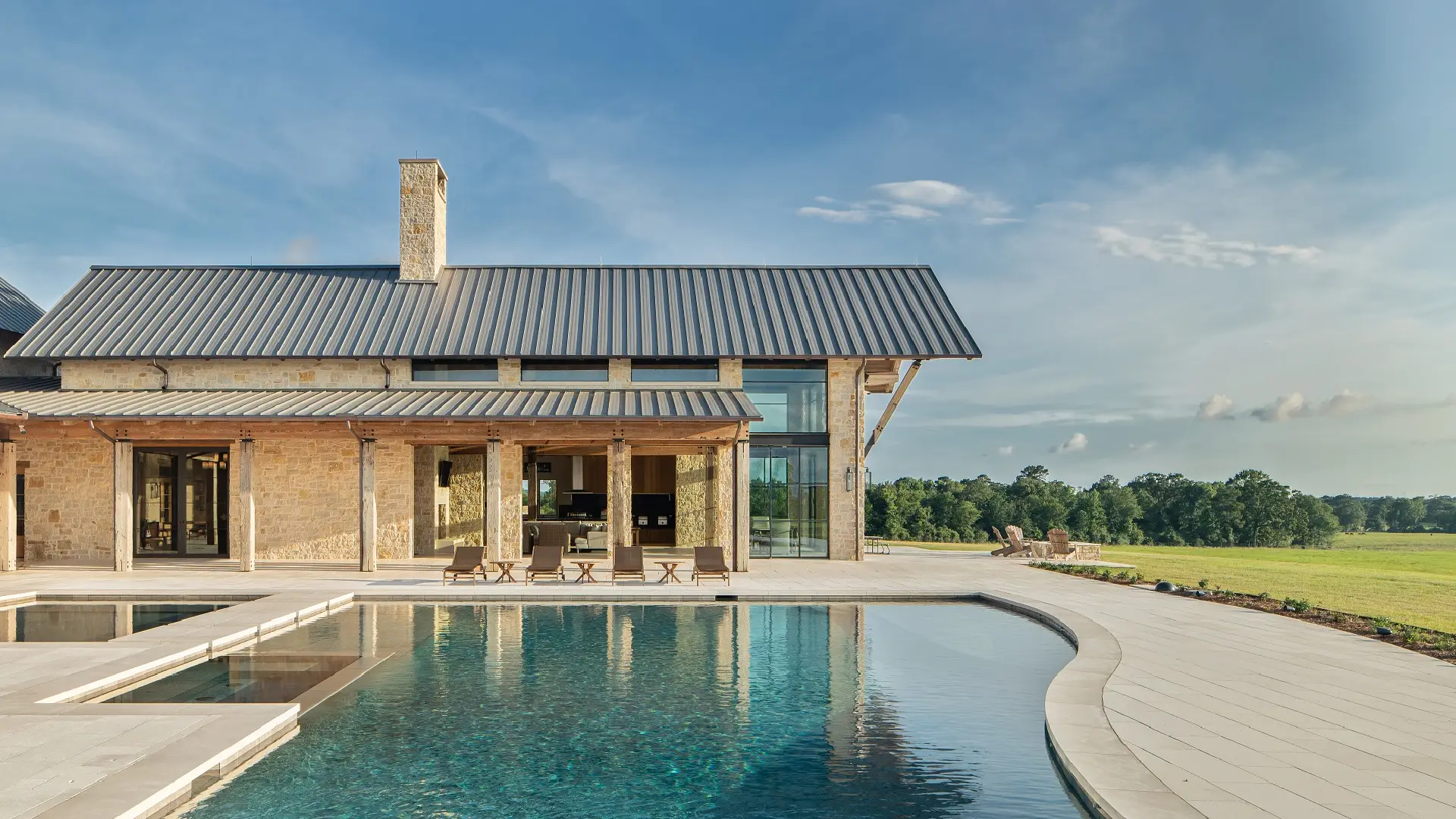 Exterior view of the pool at Texas Ranch, a custom home designed and built by Farmer Payne Architects.