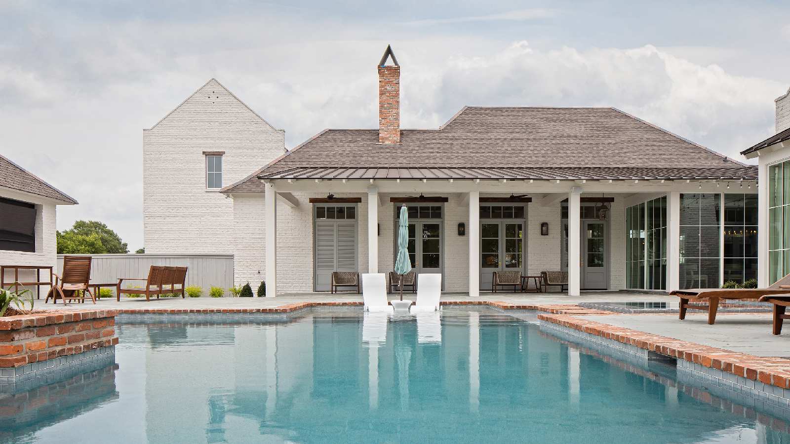 Exterior view of the pool at Oak Alley, a custom home designed and built by Farmer Payne Architects.