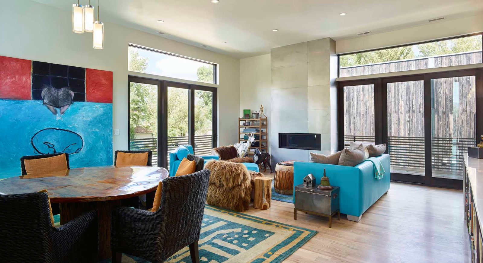 Interior view of the open-plan living room and dining room at West Hansen, a custom home designed and built by Farmer Payne Architects.