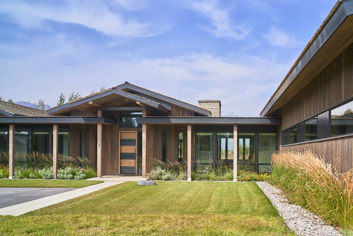 Exterior view of the front yard at G&T House, a custom home designed and built by Farmer Payne Architects.