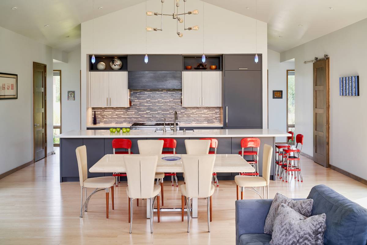 Interior view of the open-plan dining room and kitchen at G&T House, a custom home designed and built by Farmer Payne Architects.