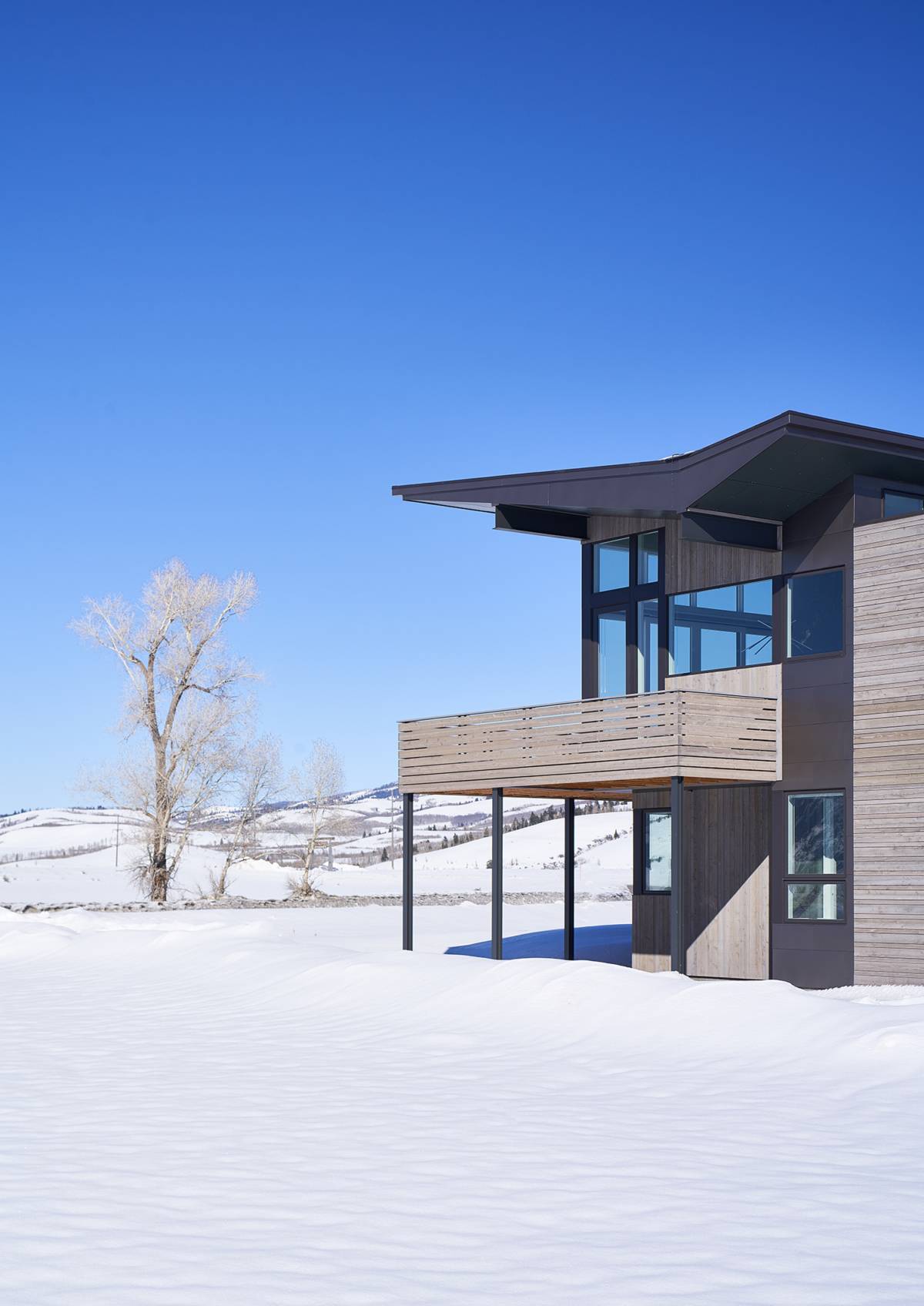 Exterior view of the upper deck at Antelope Flats, a custom home designed and built by Farmer Payne Architects.