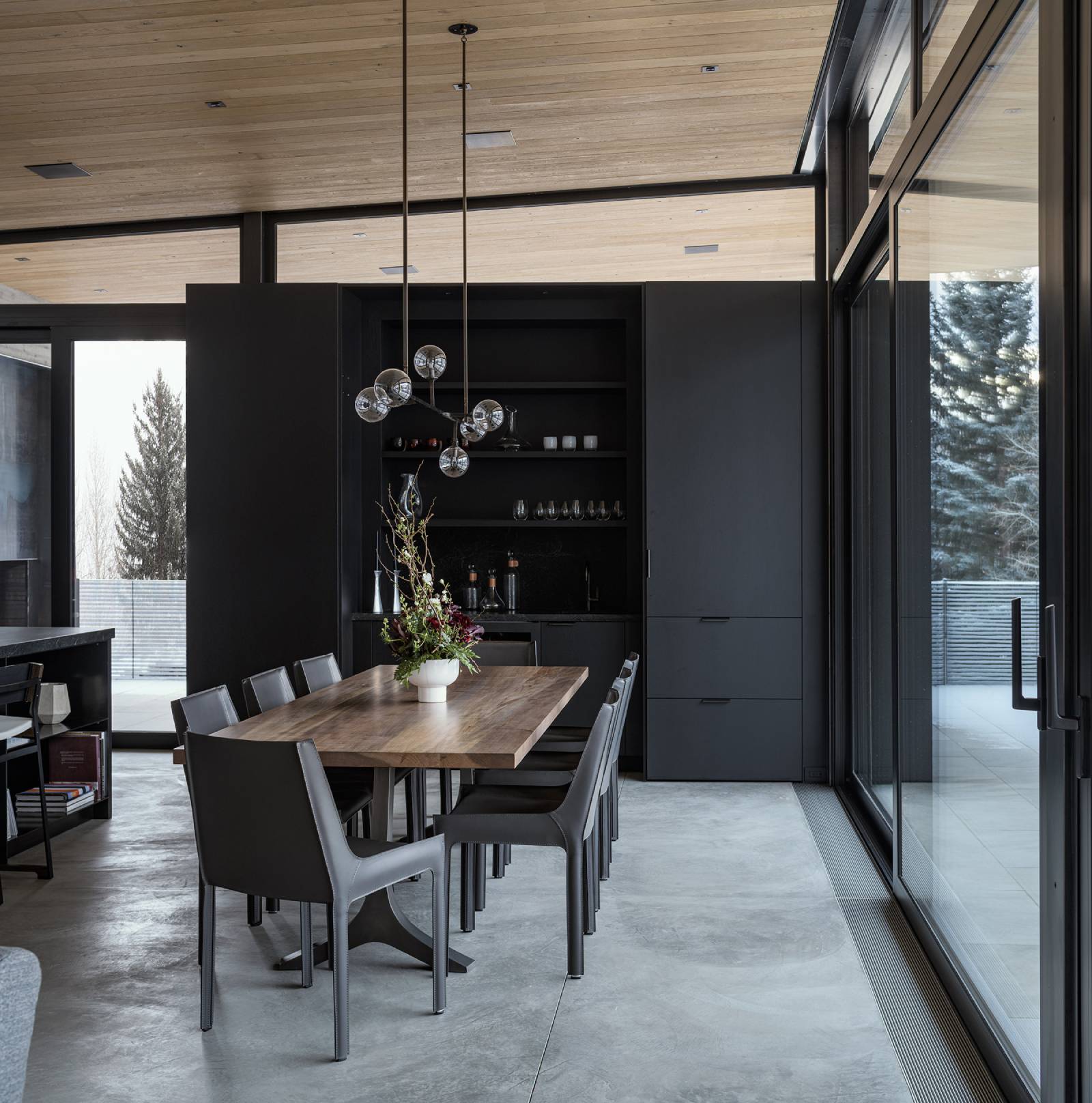 Interior view of the dining room at Avalanche Chalet, a custom home designed and built by Farmer Payne Architects.