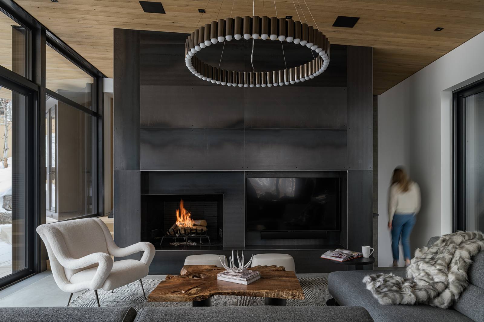 Interior view of the living room and fireplace at Avalanche Chalet, a custom home designed and built by Farmer Payne Architects.