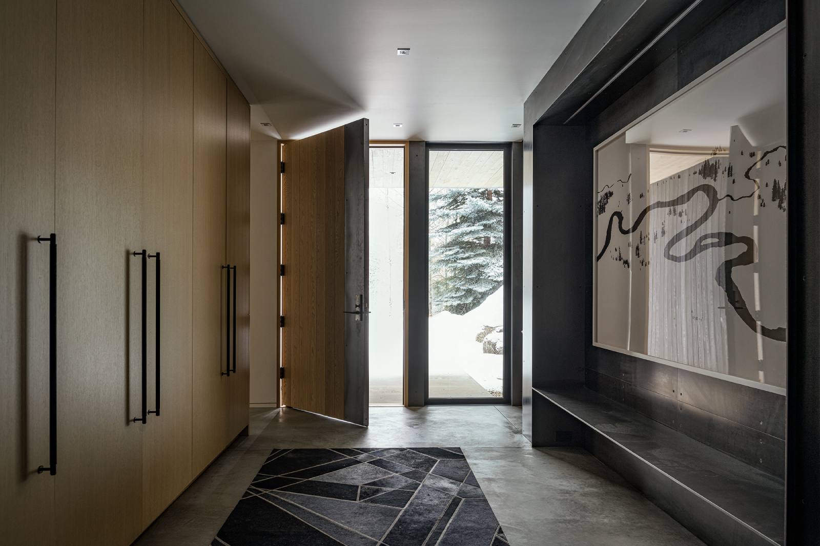 Interior view of the front entryway at Avalanche Chalet, a custom home designed and built by Farmer Payne Architects.