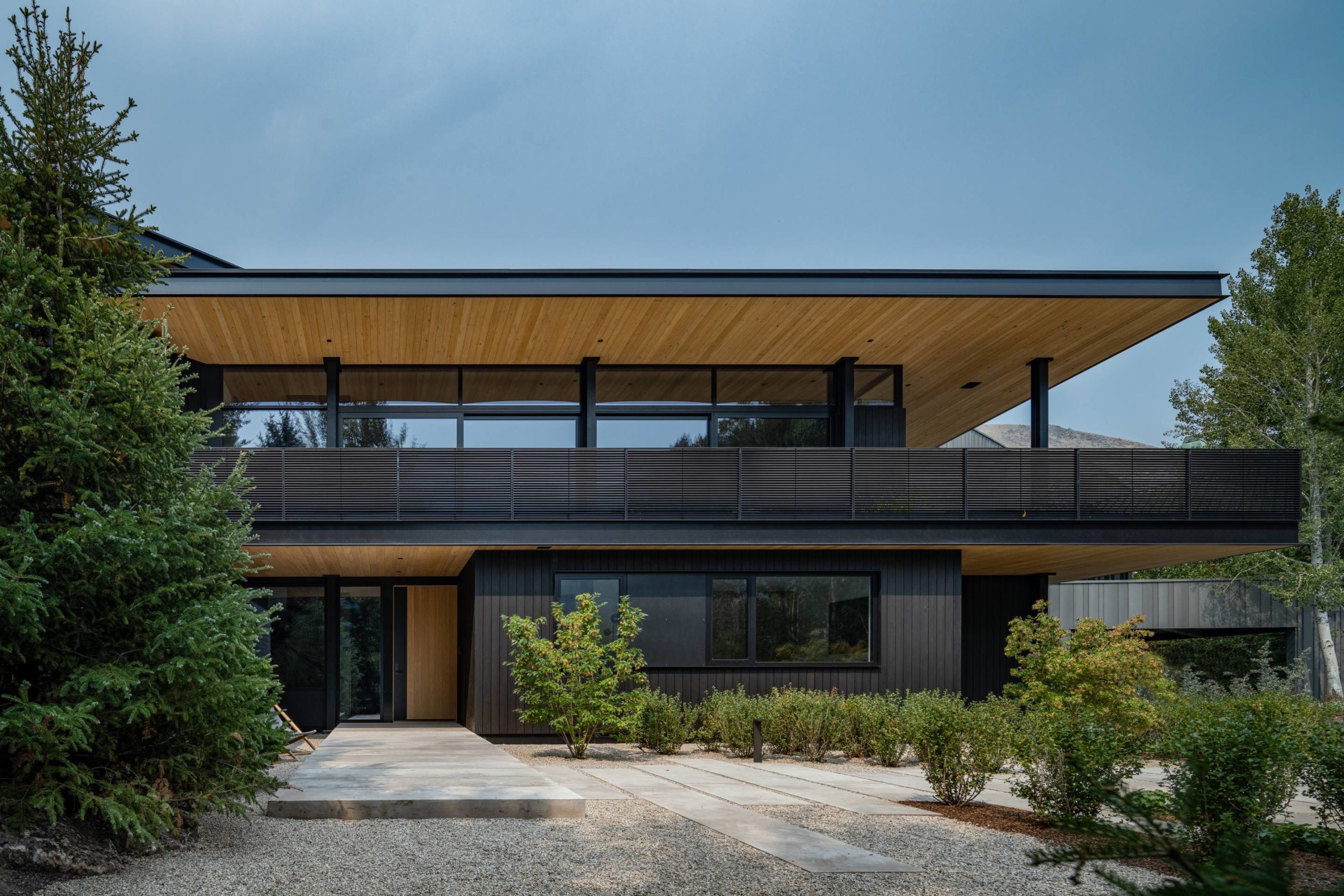 Exterior view of the landscaping at Avalanche Chalet, a custom home designed and built by Farmer Payne Architects.