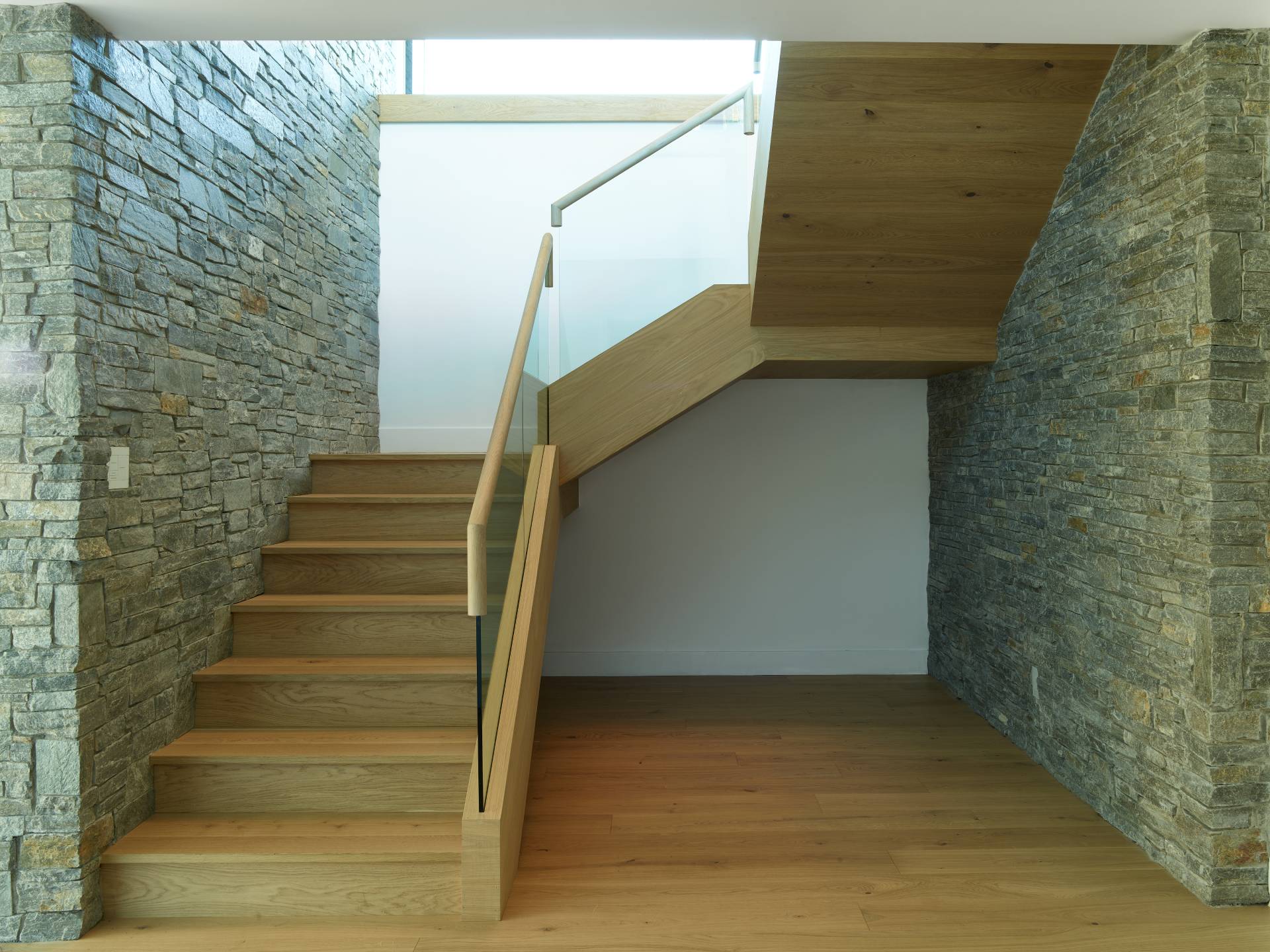 Interior view of the stairwell at Cache Creek South, a custom home designed and built by Farmer Payne Architects.
