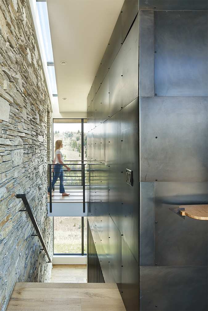Interior view of the stairwell at Gros Ventre West, a custom home designed and built by Farmer Payne Architects.