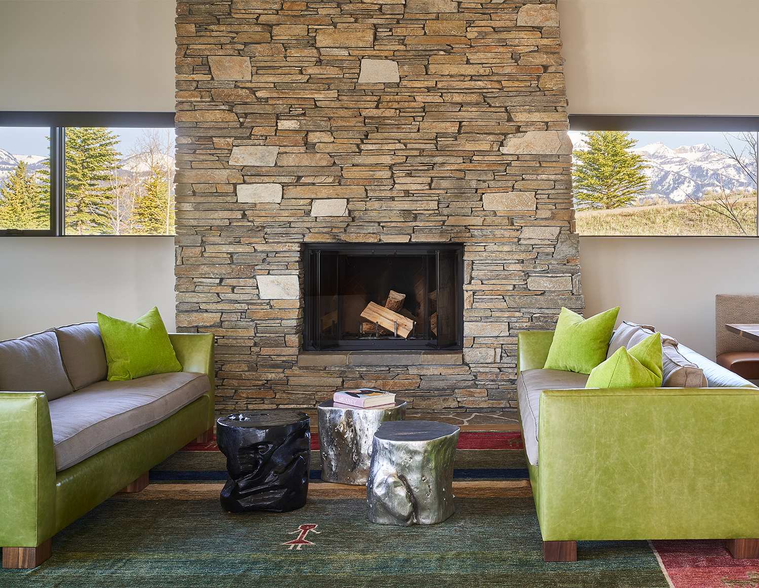 Interior view of the living room and fireplace at Gros Ventre West, a custom home designed and built by Farmer Payne Architects.