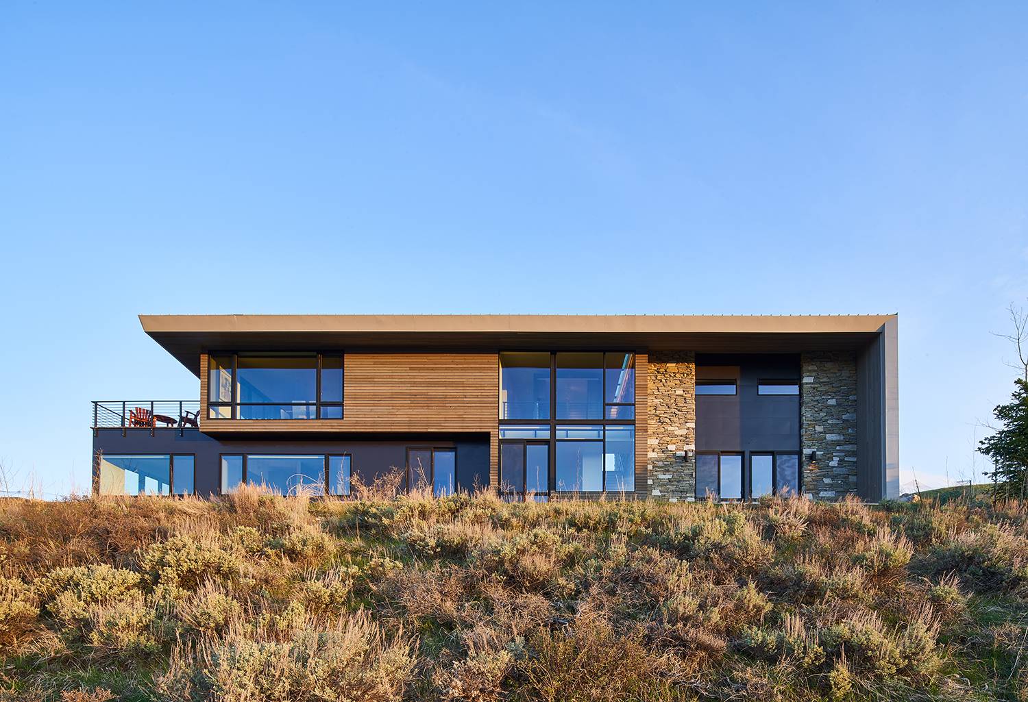 Exterior view of the back of the property at Gros Ventre West, a custom home designed and built by Farmer Payne Architects.