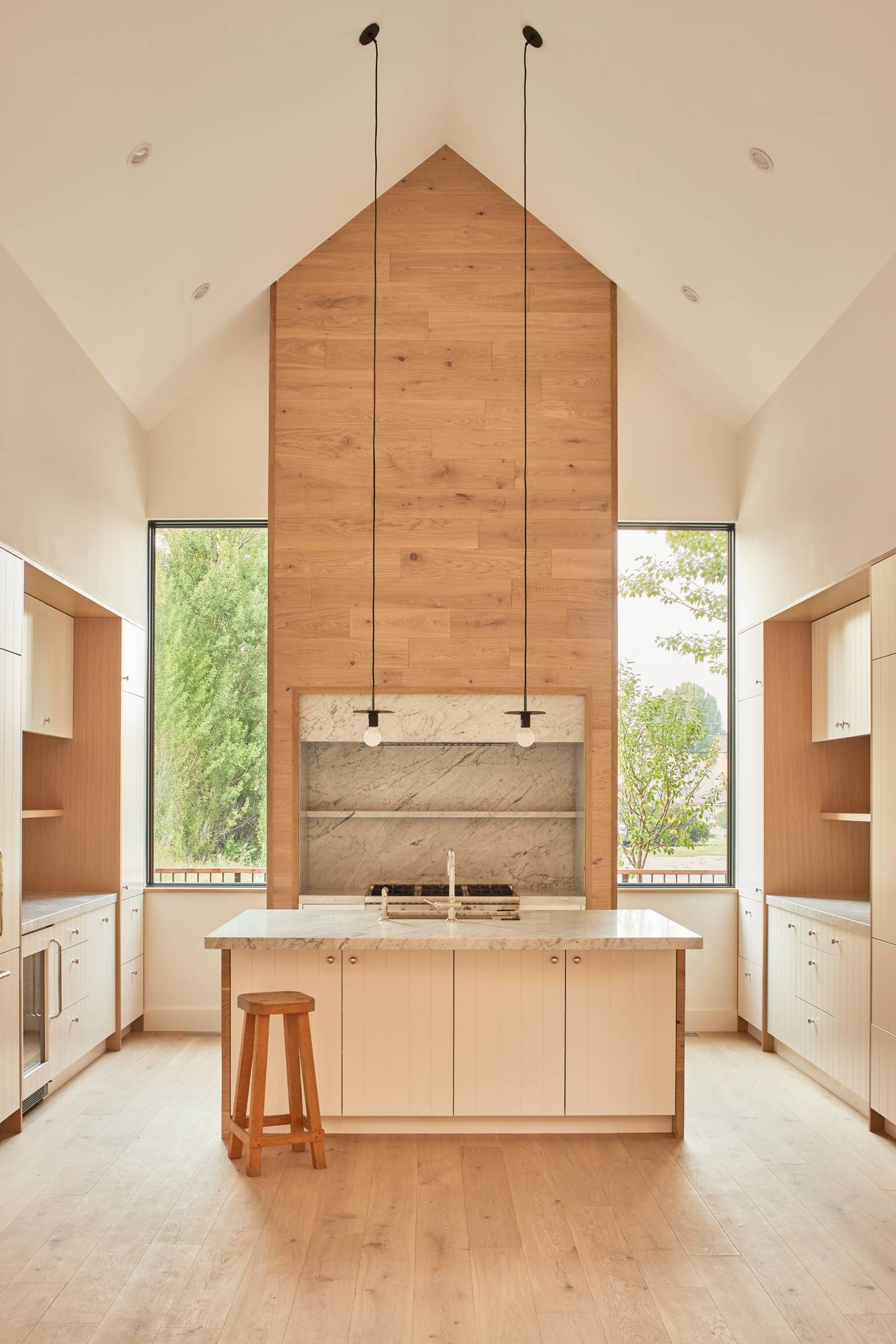 Interior view of the kitchen at Double Hansen, a custom duplex designed and built by Farmer Payne Architects.