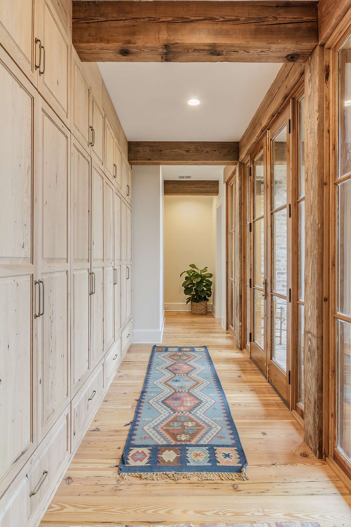 Interior view of the hallway at Louisiana Rustic, a custom home designed and built by Farmer Payne Architects.