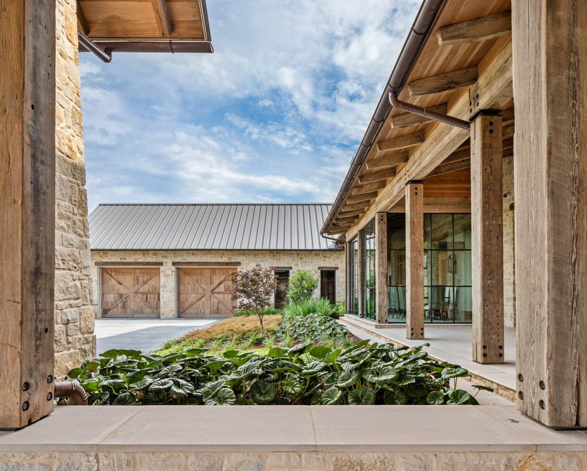 Exterior view of the garden near the front porch at Texas Ranch, a custom home designed and built by Farmer Payne Architects.