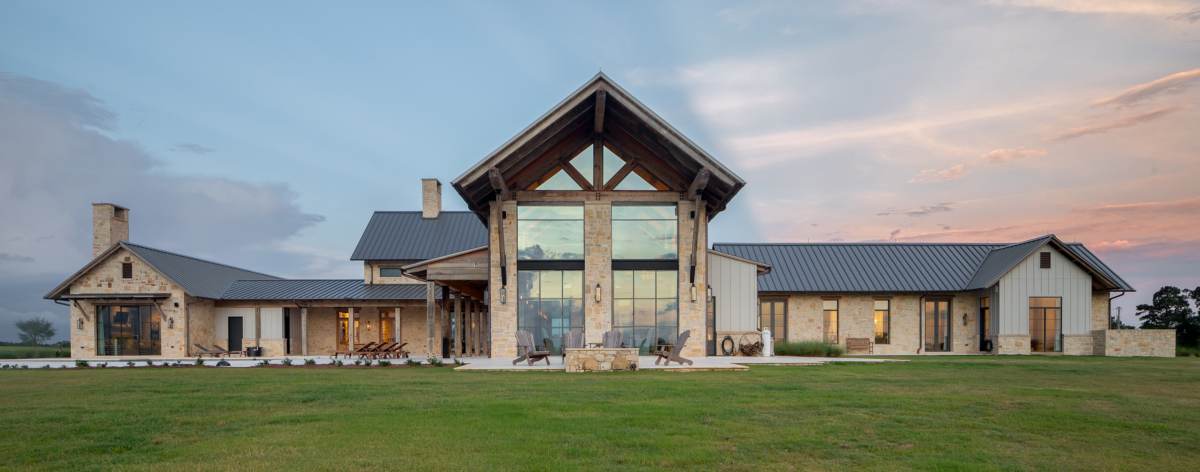 Full exterior view of the back of Texas Ranch, a custom home designed and built by Farmer Payne Architects.
