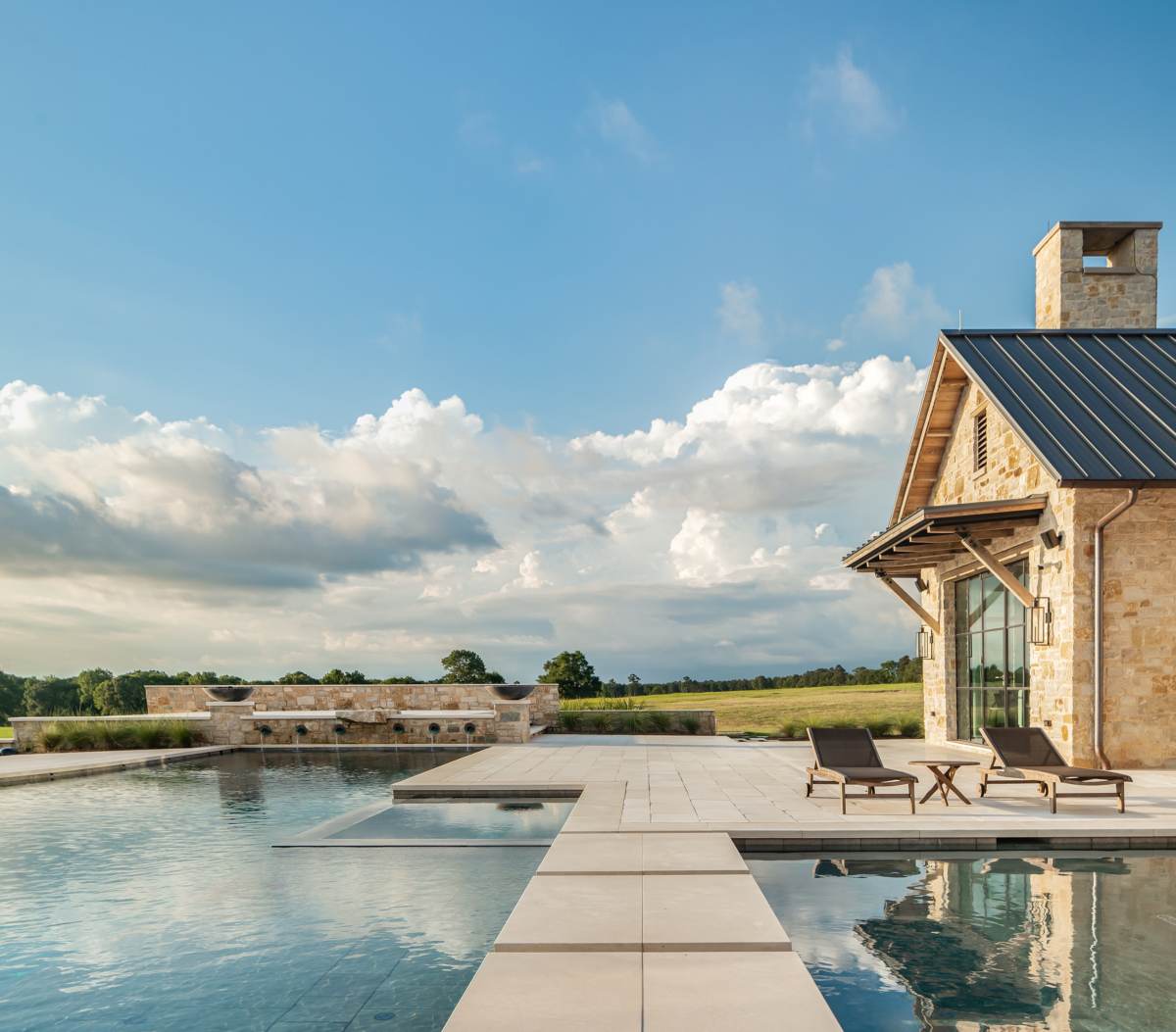 Exterior view of the pool and patio at Texas Ranch, a custom home designed and built by Farmer Payne Architects.