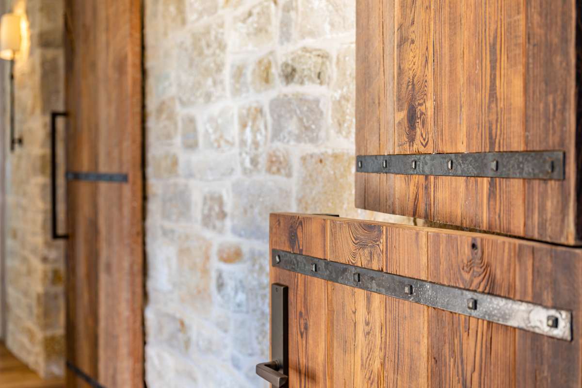 Interior detailed view of the Dutch doors at Texas Ranch, a custom home designed and built by Farmer Payne Architects.