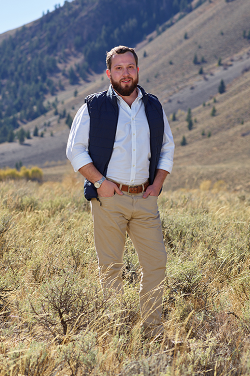 Farmer Payne Architects Project Manager Barry Holton stands in a field in Jackson Hole.