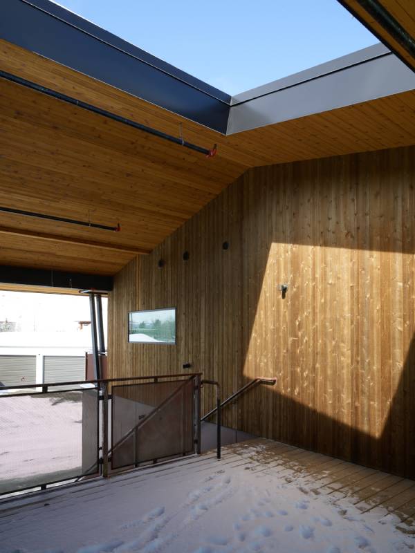 Exterior view of the outdoor stairwell at the Cowboy Coffee Company building, a custom multi-use space designed and built by Farmer Payne Architects.